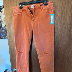 Orange mid rise skinny pants
